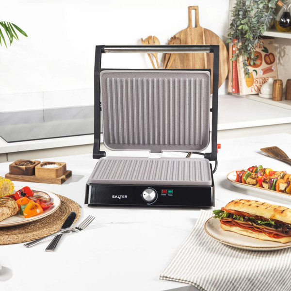 Electric grill with steak, prawns and vegetables, Salter brand, served with chips.