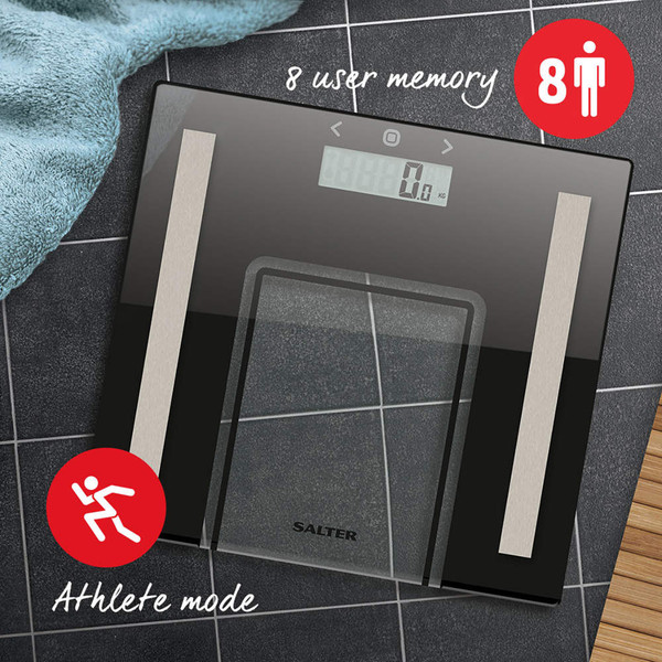 Black glass digital bathroom scale with display, 8 user memory and athlete mode, on tiled floor