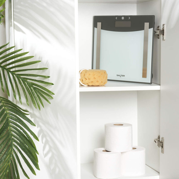 Digital bathroom scale with clear glass platform and large LCD display, shows zero reading.