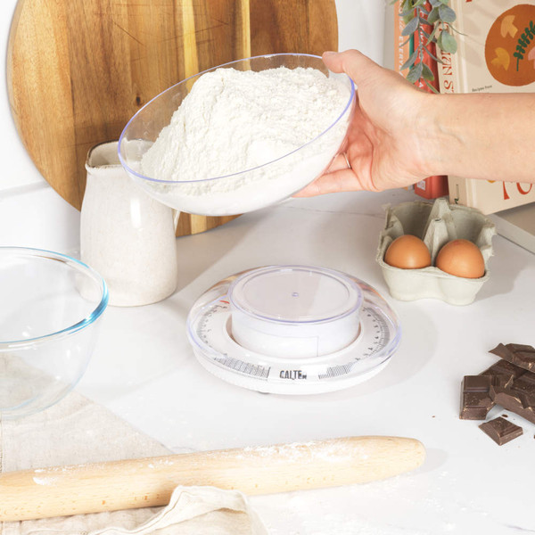 Salter mechanical kitchen scale in drawer, clear bowl, shown beside wooden utensils