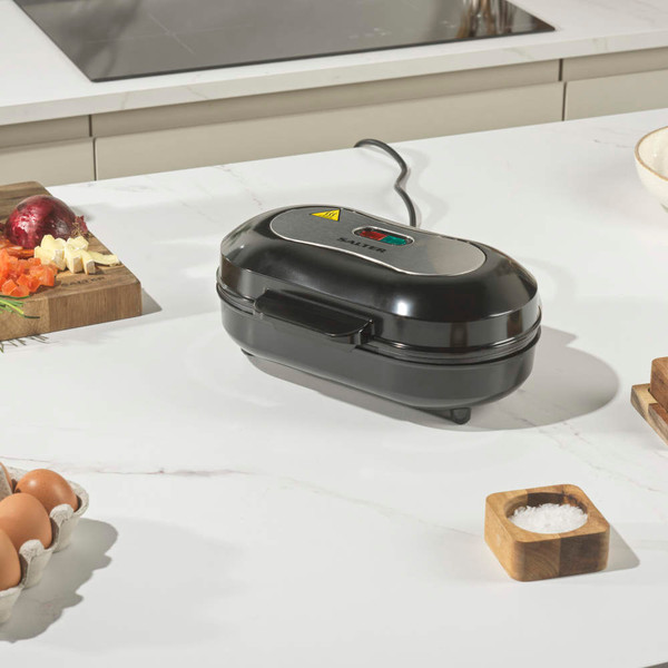 Double breakfast sandwich maker, black, open on kitchen counter
