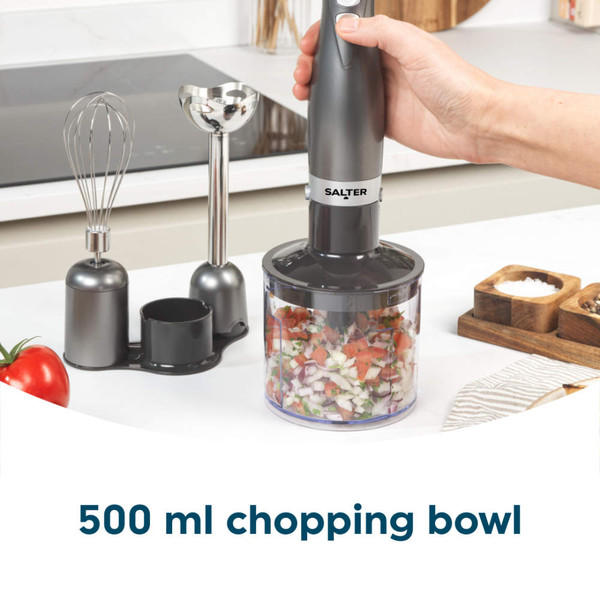Salter gunmetal hand blender blending tomato sauce in cream casserole dish on wooden board