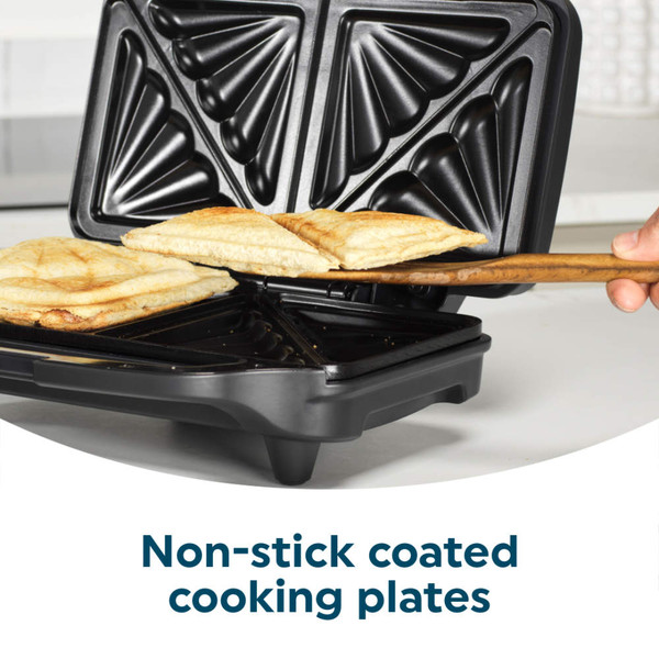 Black Salter sandwich toaster open on kitchen counter, showing toasted sandwiches inside.