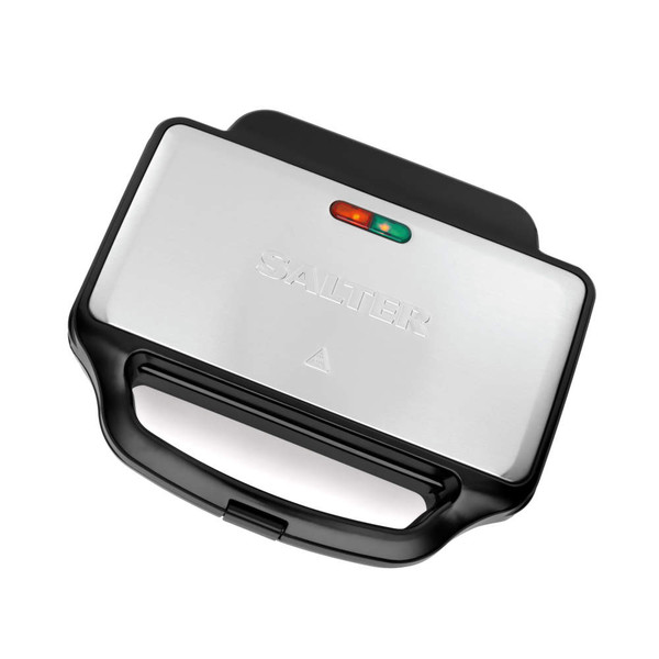 Sandwich toaster with toasted sandwiches being lifted out using a wooden spatula