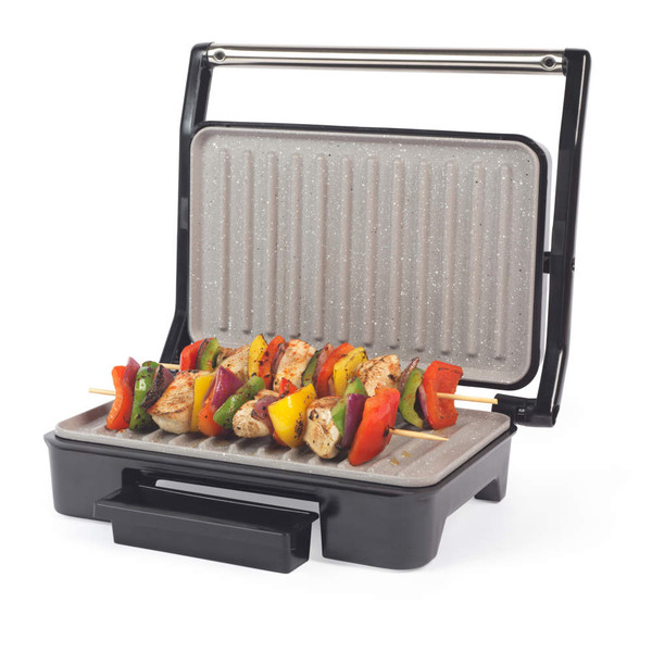 Open electric grill with skewers of grilled chicken and colourful vegetables.