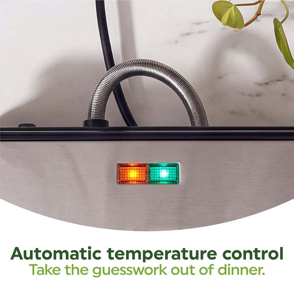 Black panini press toasting sandwich with tomato, cheese, and basil, lid partially closed