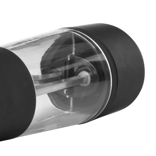 Close-up of black and clear manual pepper grinder showing grinding mechanism