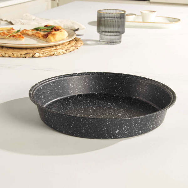 Set of grey speckled non-stick baking trays and tins displayed with baked goods