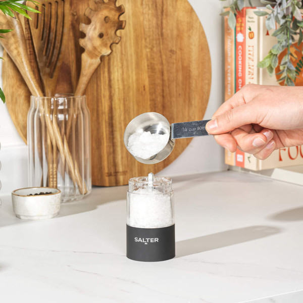 Set of two black electric grinders for salt and pepper, side by side