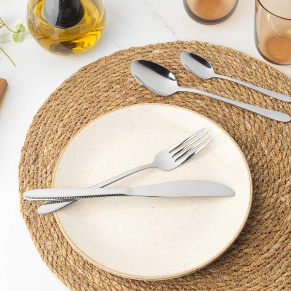 4-piece silver stainless steel cutlery set with textured handles: knife, fork, spoon, teaspoon