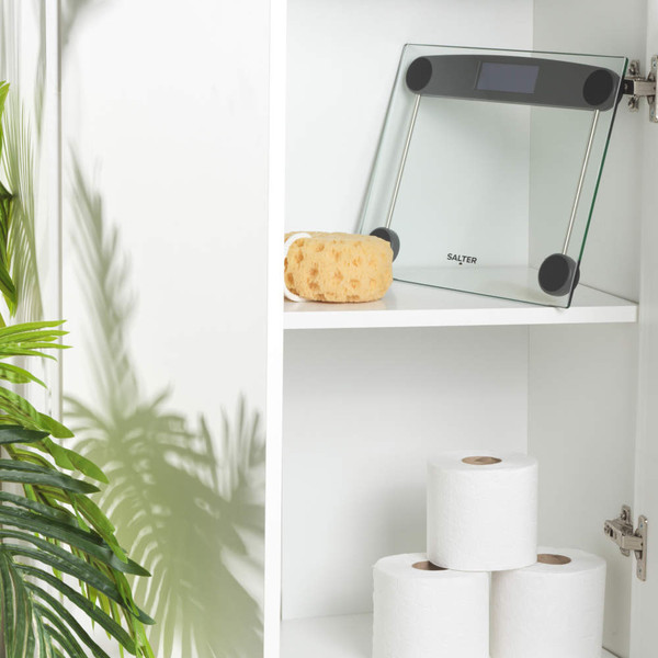 Glass digital bathroom scale with black detail, showing 0.0 kg on display