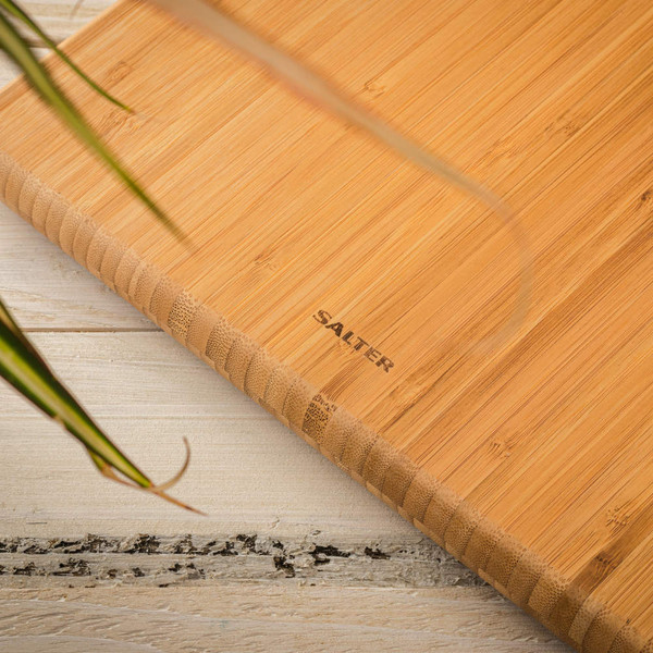 Close-up of Salter bamboo chopping board corner showing engraved logo.