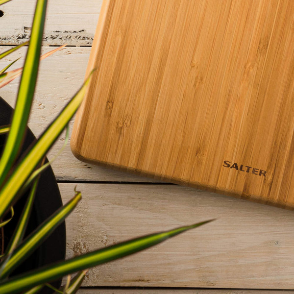 Bamboo chopping board with Salter logo on light wooden surface
