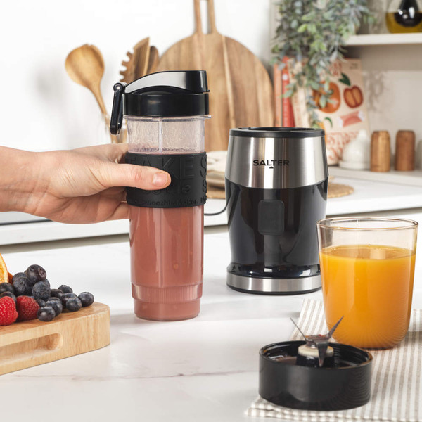 Clear sports water bottle with black flip-top lid and grip band