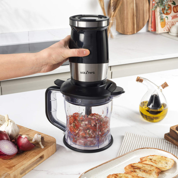 Black and silver blender set with smoothie cup, jug, and assorted fruit and veg