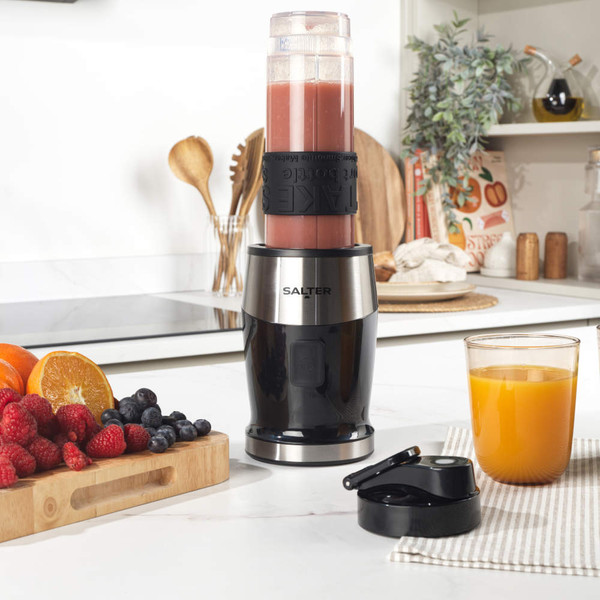 Salter smoothie maker with pink blended drink and fresh strawberries, kiwi, and blueberries