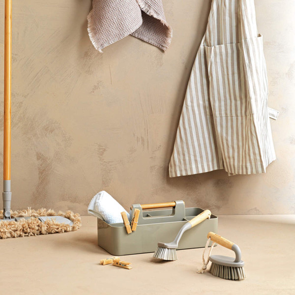 Neutral cleaning accessory set with brushes, mop, striped apron and caddy, styled for product listing