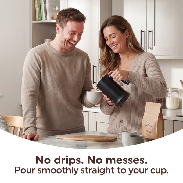 Lifestyle image: electric kettle pouring coffee with drip-free design in kitchen setting
