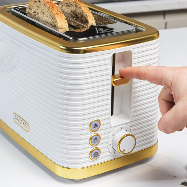 White and gold Salter toaster with two slices of bread, shown in use.