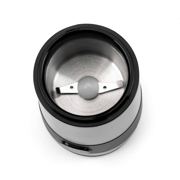 Silver electric coffee grinder with ground coffee, shown on kitchen worktop