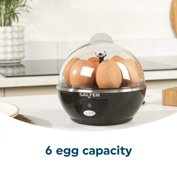 Black egg cooker with six eggs under clear lid