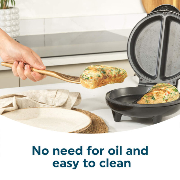 Black non-stick breakfast maker, open, showing two deep compartments