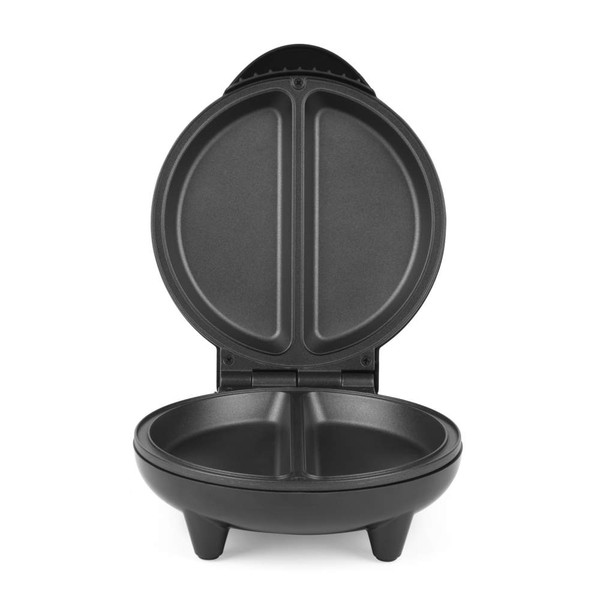 Black omelette maker with two filled omelettes, served beside a plate of salad