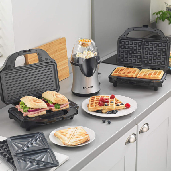 Salter sandwich, waffle, and grill makers with food in kitchen setting