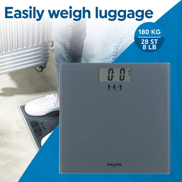 Grey digital scale weighing suitcase, ideal for travel; maximum weight 180 kg.