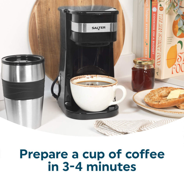 Single-serve black coffee machine with travel mug and cup of coffee
