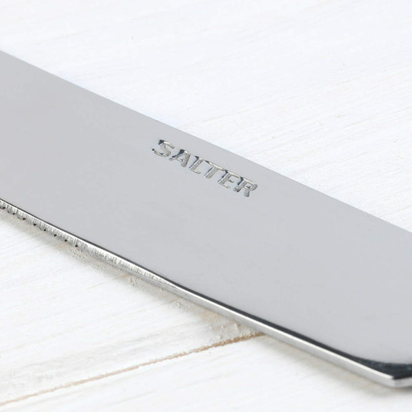 Close-up of serrated stainless steel knife with Salter branding.