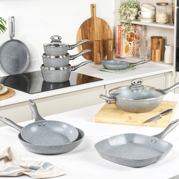 Set of three grey non-stick saucepans with glass lids, displayed on white background.