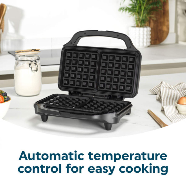 Open black waffle maker with automatic temperature control