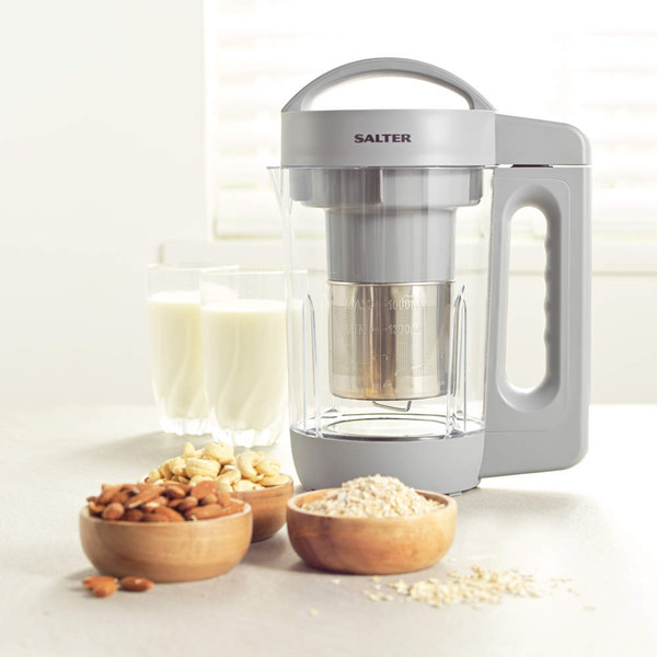 Salter grey plant-based milk maker with nuts, oats, and glasses of milk on table