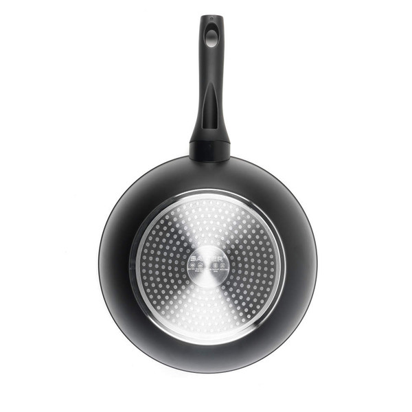 Black frying pan, bottom view showing induction base and handle