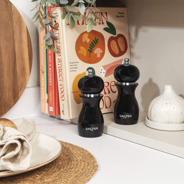 Pair of black Salter salt and pepper mills on kitchen worktop