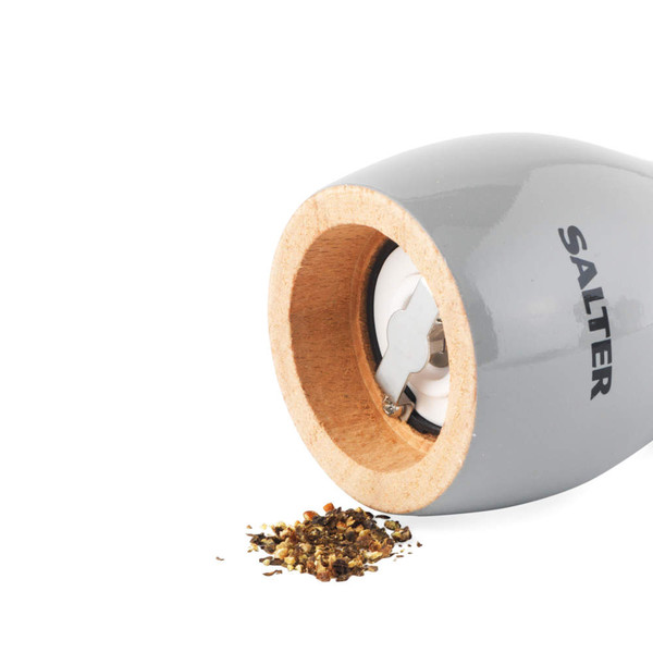Grey salt and pepper mills set with gold tops, shown from above.