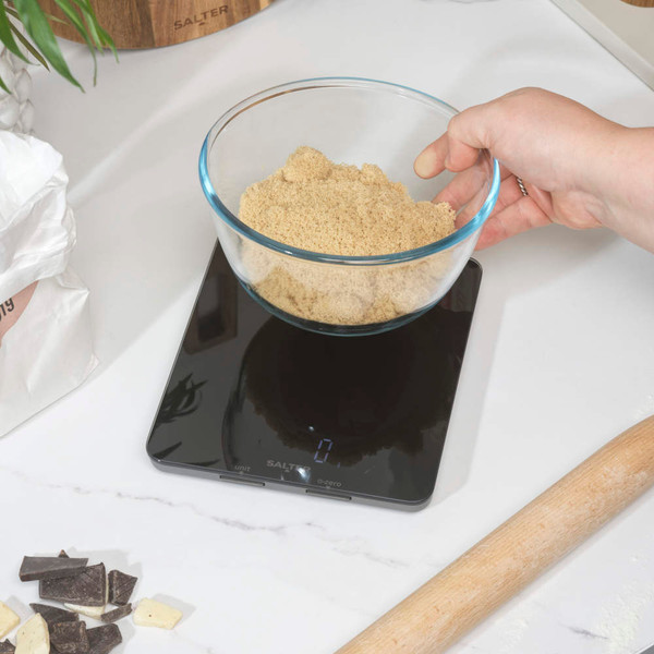 Black digital kitchen scale, showing dimensions 19cm x 16.5cm x 2cm