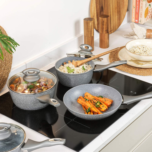 Set of four grey stone-effect saucepans and frying pan with glass lids