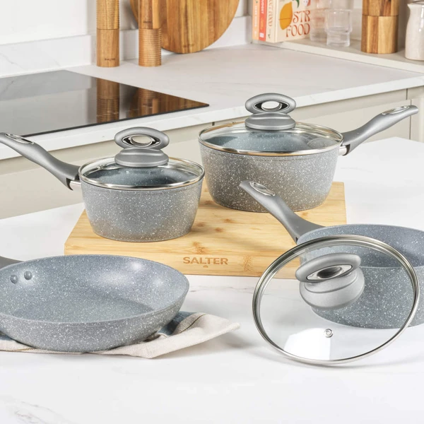 Grey speckled non-stick frying pan with handle, angled side view