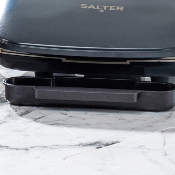 Salter grill close-up showing black drip tray on marble surface
