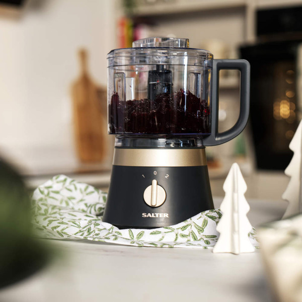 Salter food processor in grey and gold with chopped beetroot, on kitchen counter