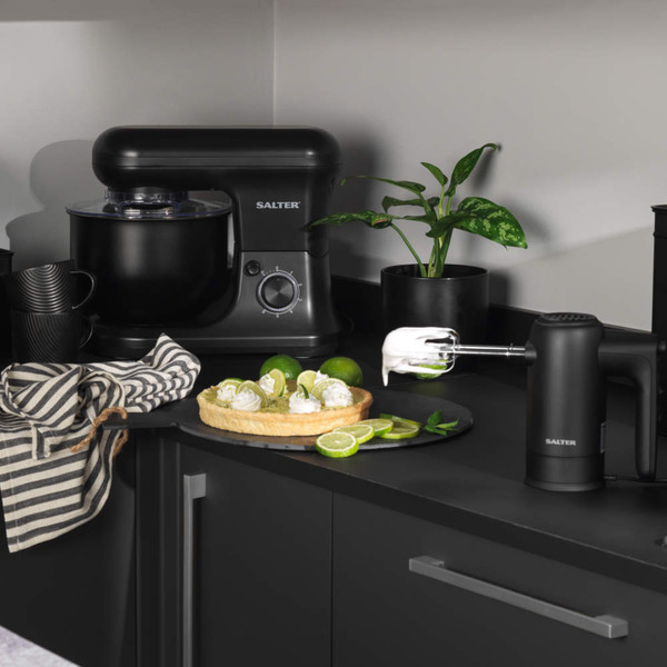 Black Salter hand mixer and stand mixer in kitchen setting with lime dessert