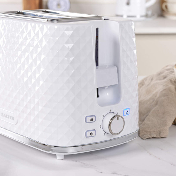 White textured 2-slice toaster with chrome trim, shown on kitchen counter