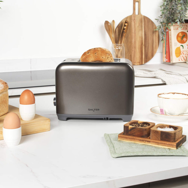 Gunmetal toaster, microwave, and kettle set on kitchen counter
