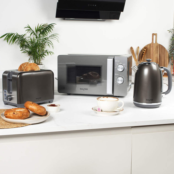 Gunmetal toaster, microwave, and kettle set on kitchen counter