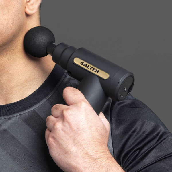 Black Salter massage gun used on man's neck