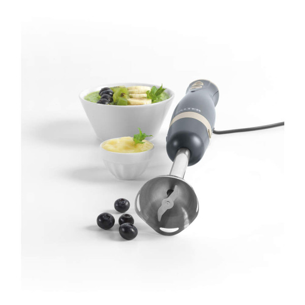 Grey hand blender with metal blade, shown beside smoothie bowls and blueberries