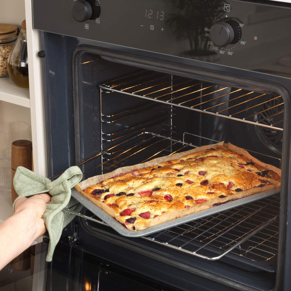 Grey speckled rectangular oven tray with raised edges, shown at an angle