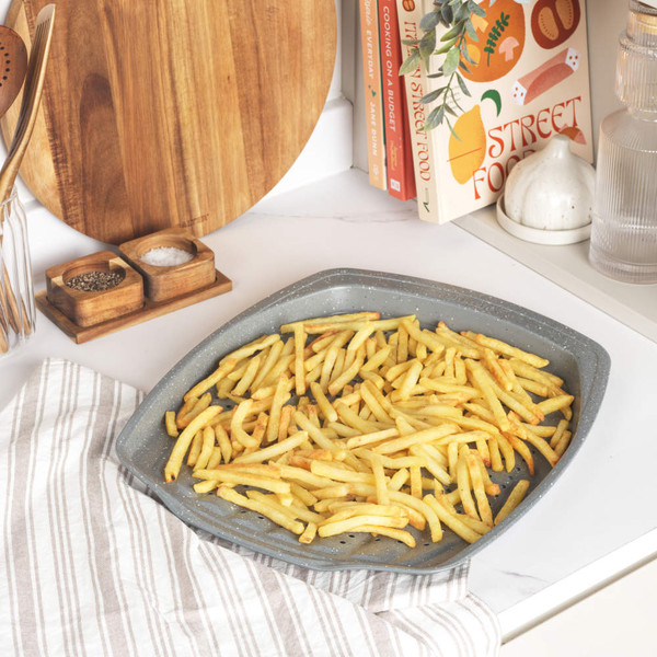 Grey square pizza tray with holes for a crisp base